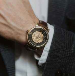 person wearing silver and gold chronograph watch